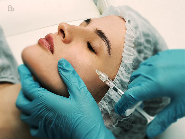 Dermatologist performing precise Botox injections for natural facial rejuvenation
